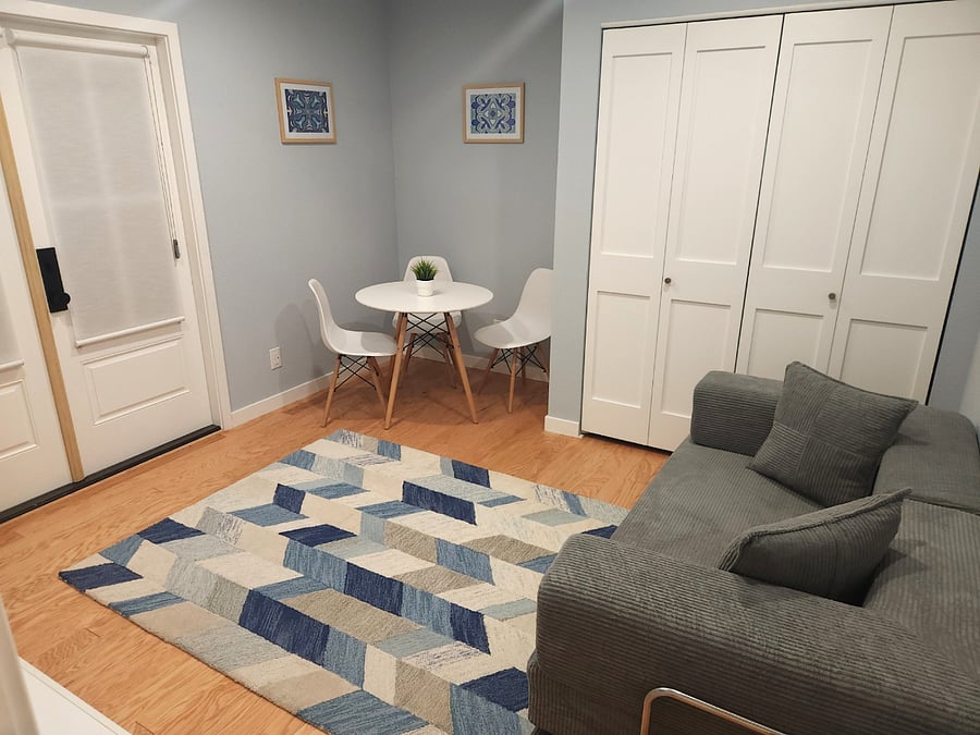 Elegant living room with hardwood floors, which opens via the French doors into the patio cafe. Smart TV for you to login and enjoy multiple streaming channels. The couch conveniently converts into a sleeper for two. Modern dining table for meals.