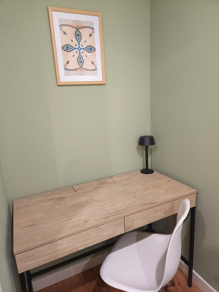 Dedicate workstation with handy outlets built into the desk itself.