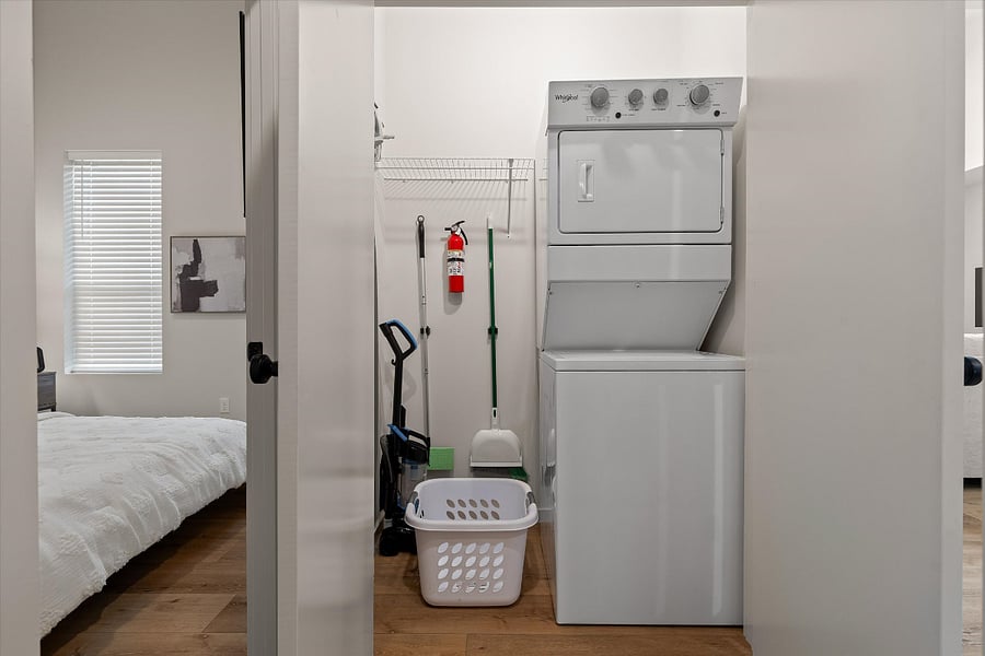 Laundry Room with cleaning supplies and ironing board/iron