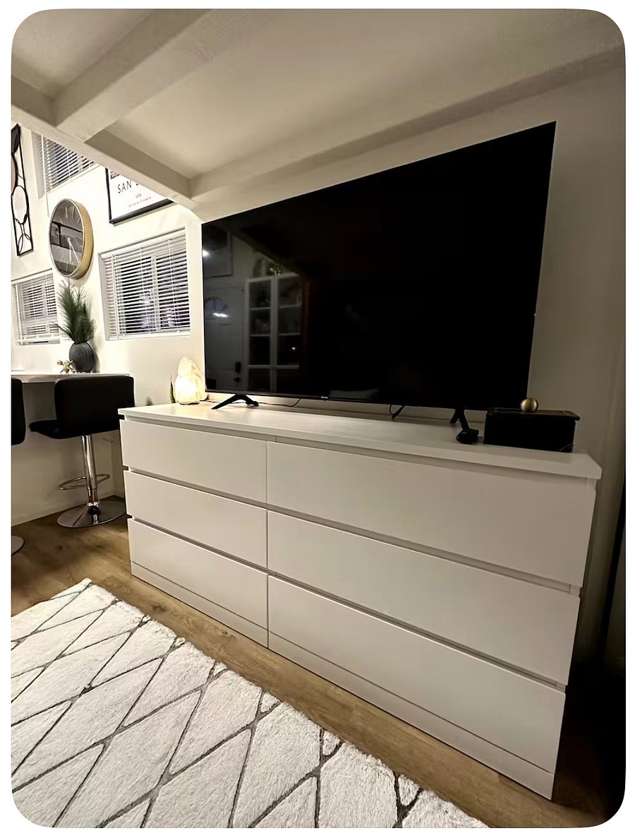 58" 4K TV with dresser drawer storage space.