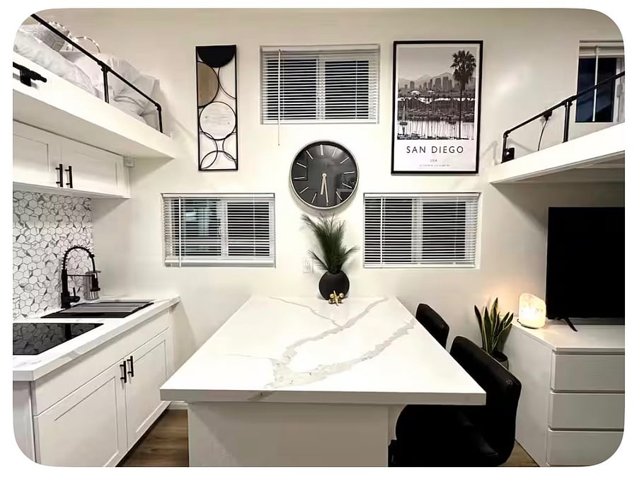 Calacutta countertop serves also as a workstation.