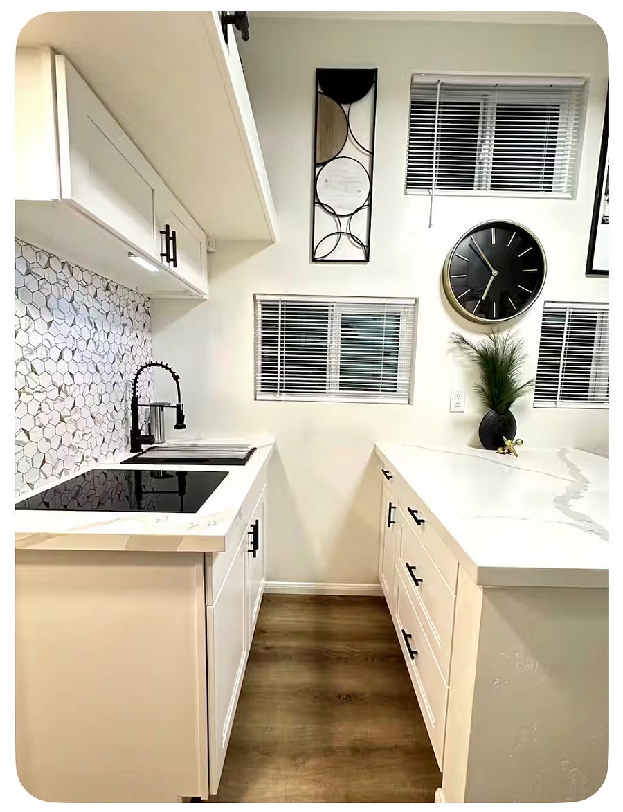Kitchen equipped with induction stove top.