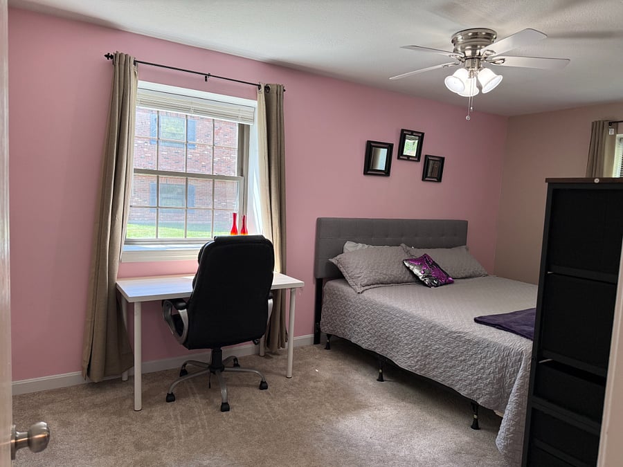 Bedroom 1, King Bed, dresser, full wall closet, desk and chair, ceiling fan.