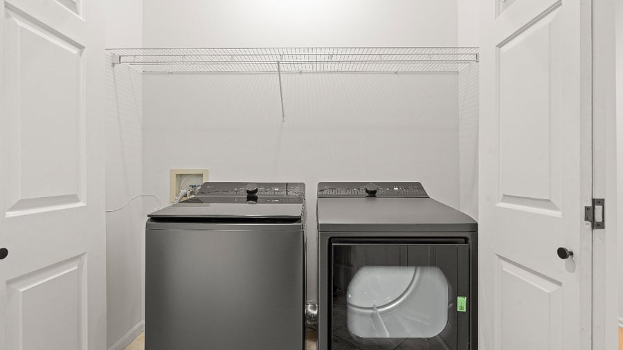 Dedicated laundry area on the main level with a smart washer and dryer for easy, convenient laundry care.
