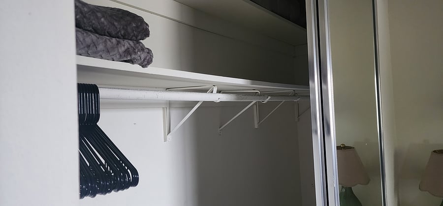 Spacious closet with large mirrors