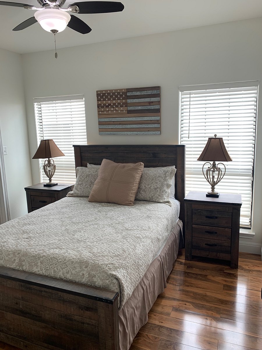Master bedroom with walk in closet and inside door access to bathroom. Queen bed