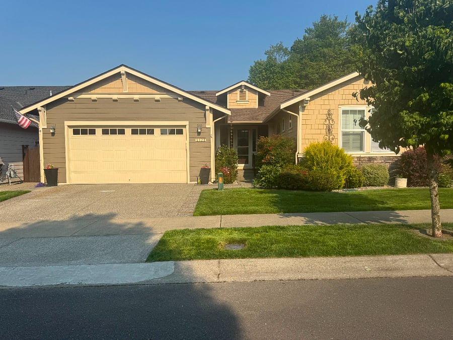 front of house on tree lined street