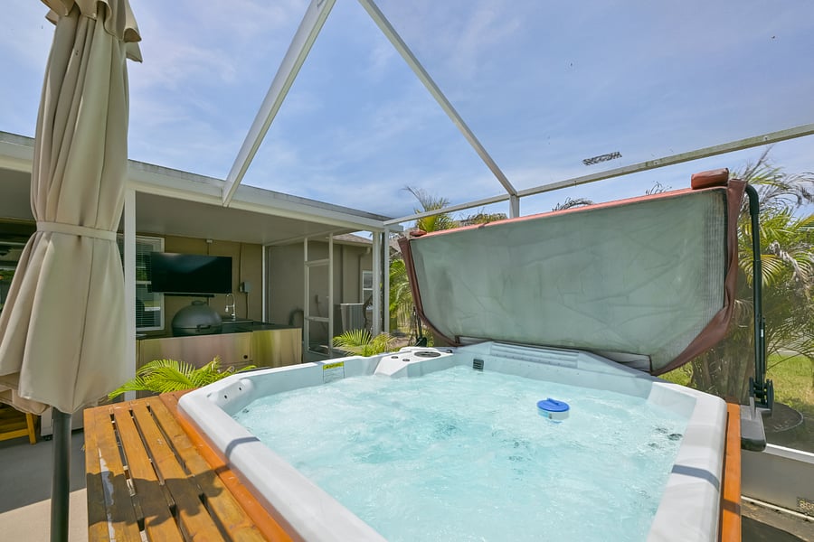 Room for 8 and a TV to watch from the jacuzzi!