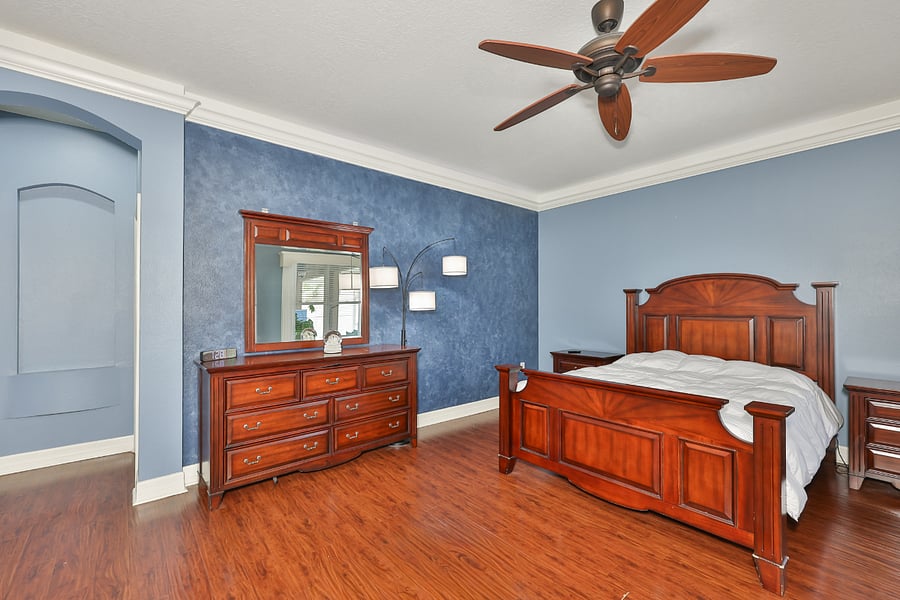 Primary bedroom with wall mounted tv