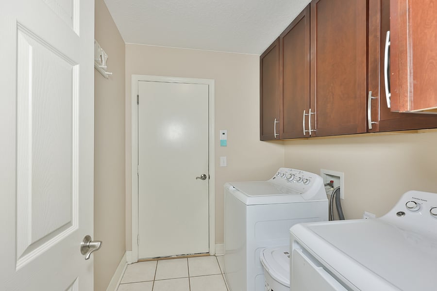 Washer and dryer. Door leads to 3 car garage
