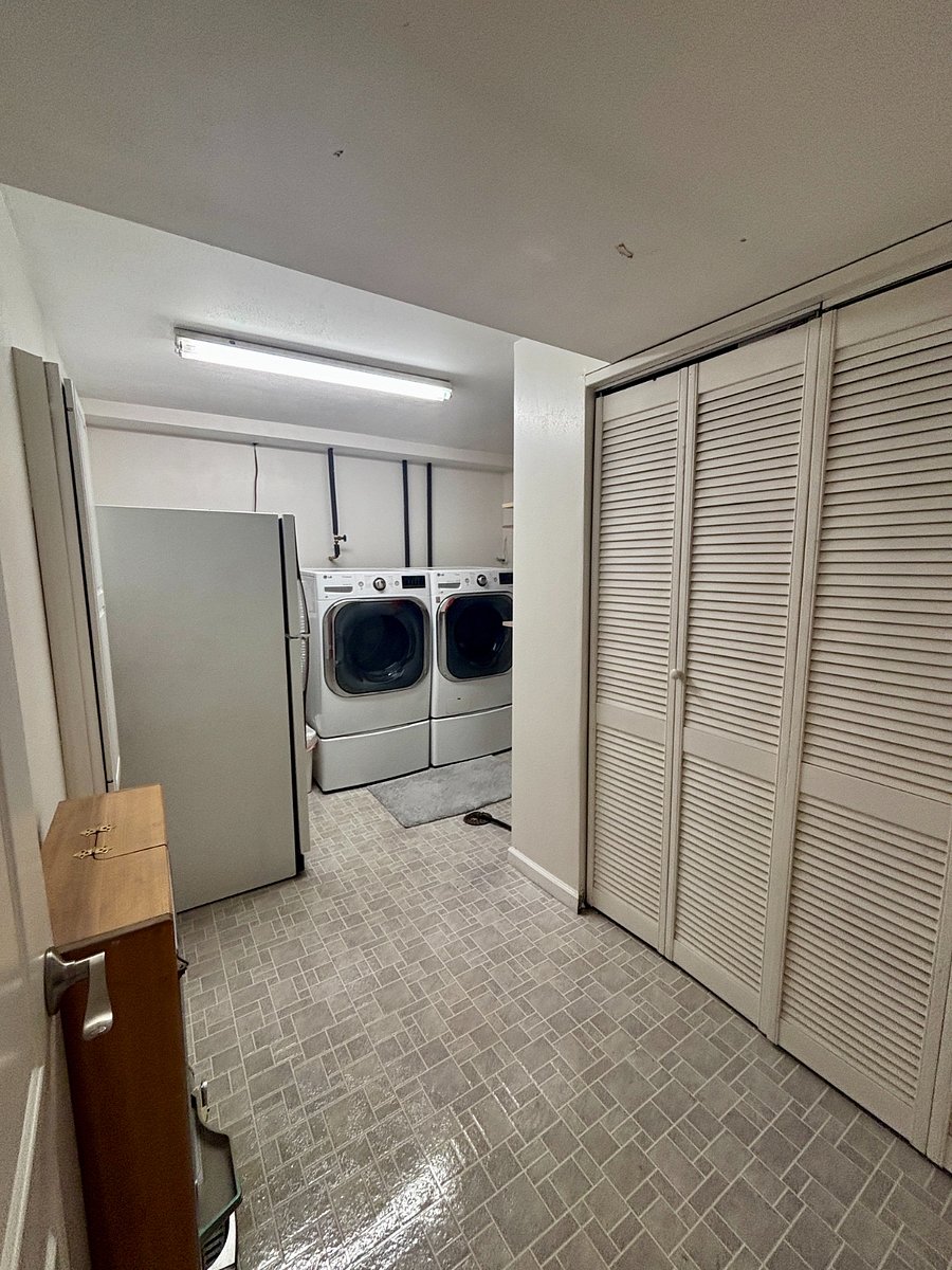 Washer Dryer, Built in Ironing Board and Iron, Fridge, Additional Storage