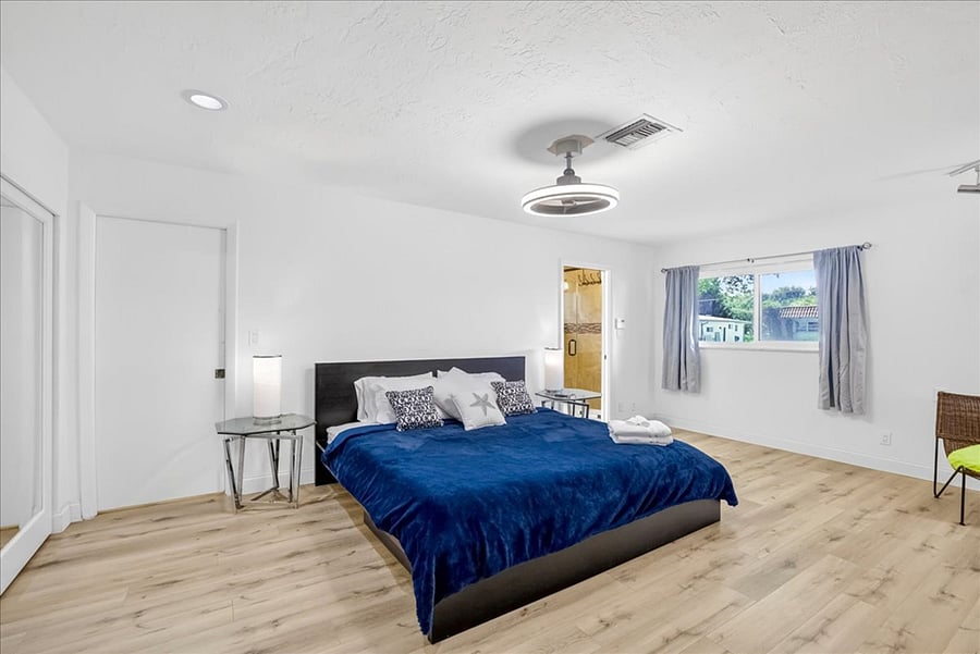 Master bedroom with king bed and TV