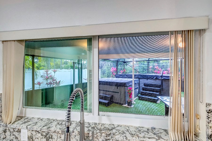 Kitchen view of patio spa and pool