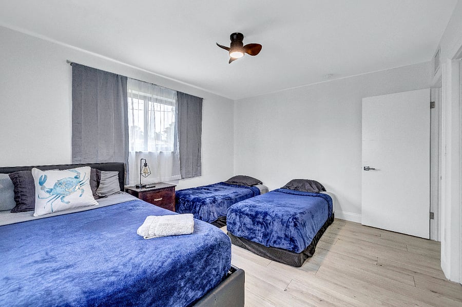 Bedroom 2 with 1 queen bed & 2 single beds