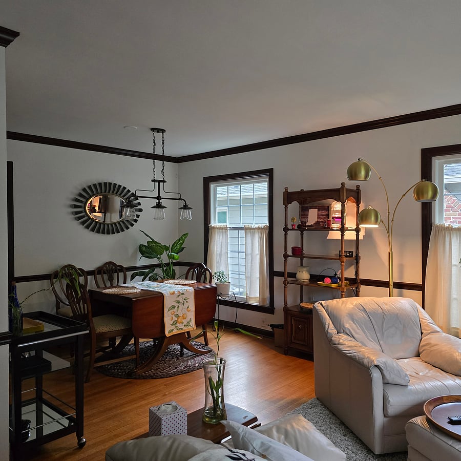Dining area has drop leaf table and 4 chairs.