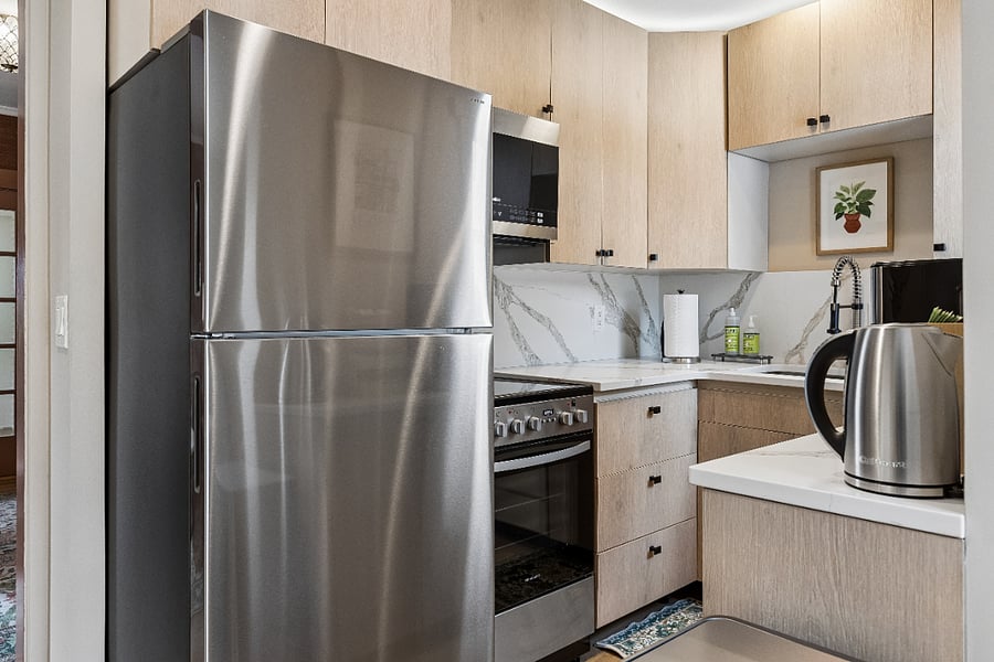 Modern finishes, stainless steel appliances, and ample counter space make cooking easy and convenient.