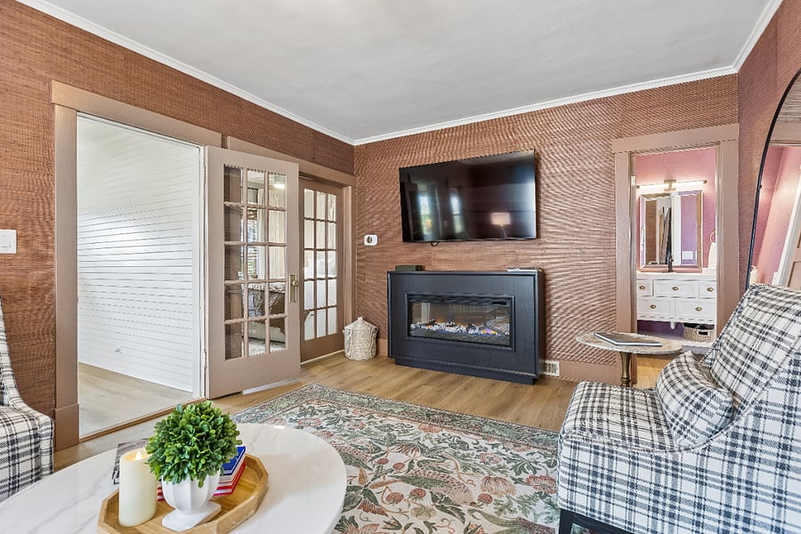 Enjoy the cozy electric fireplace, 65" Smart TV, and designer furnishings. It's the perfect place to unwind after exploring Omaha or a day at UNMC.