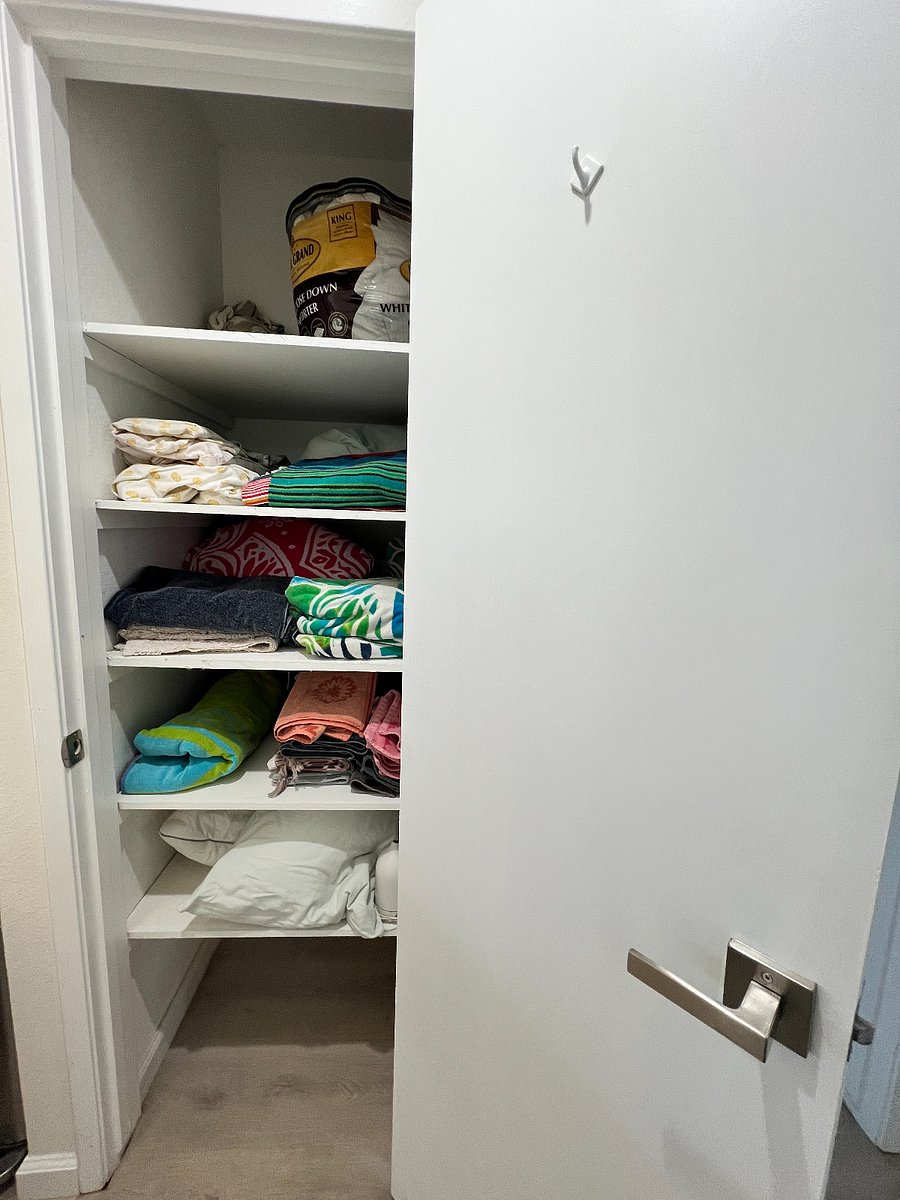 Hall closet with linens and towels plus an oil diffuser :)