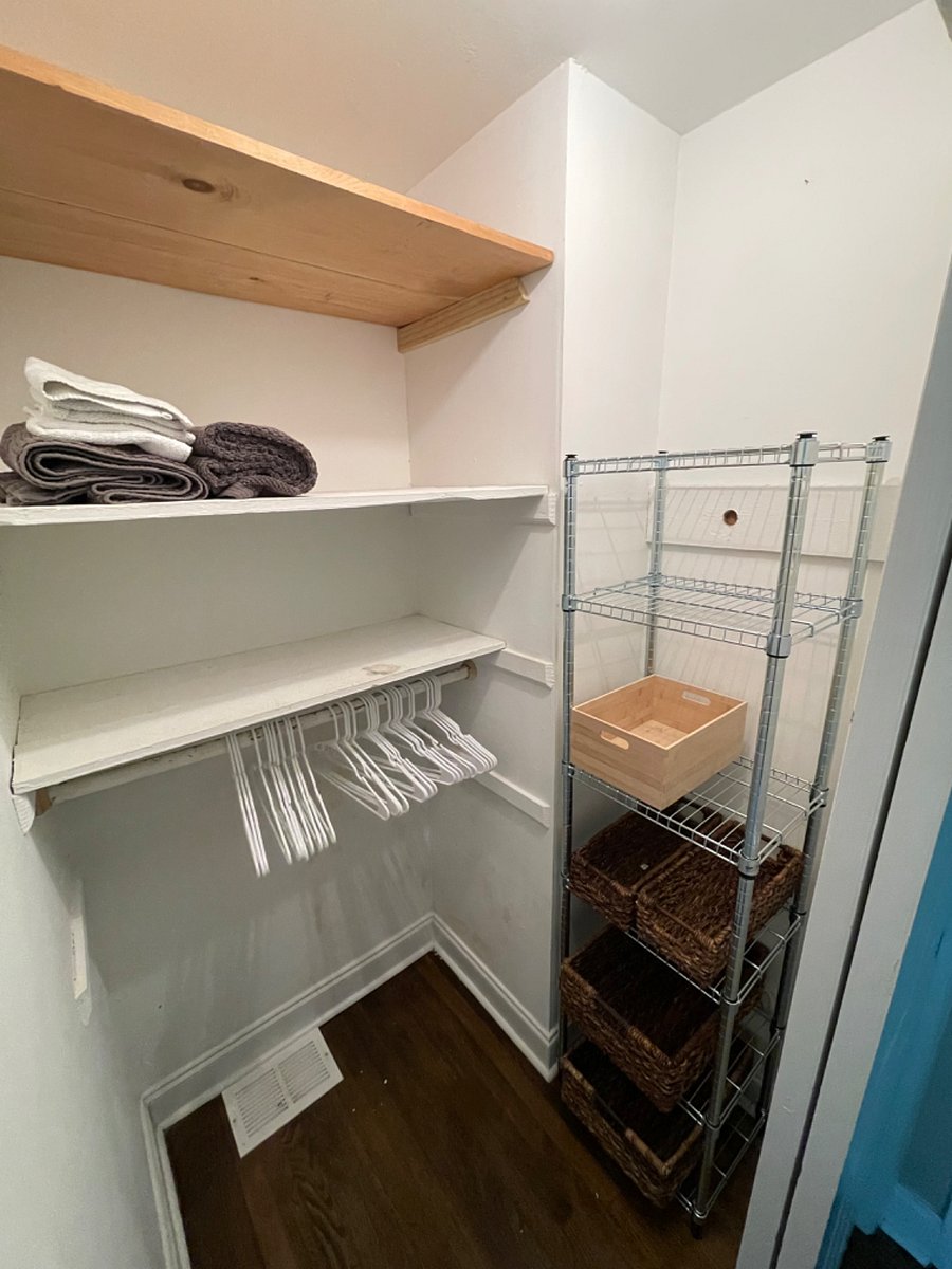 primary room closet with plenty of shelving & clothes hangers