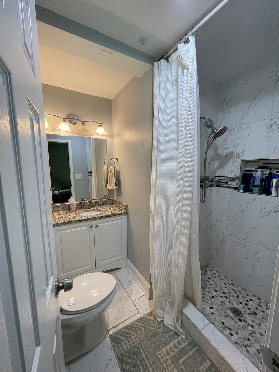 bathroom with shower head wand