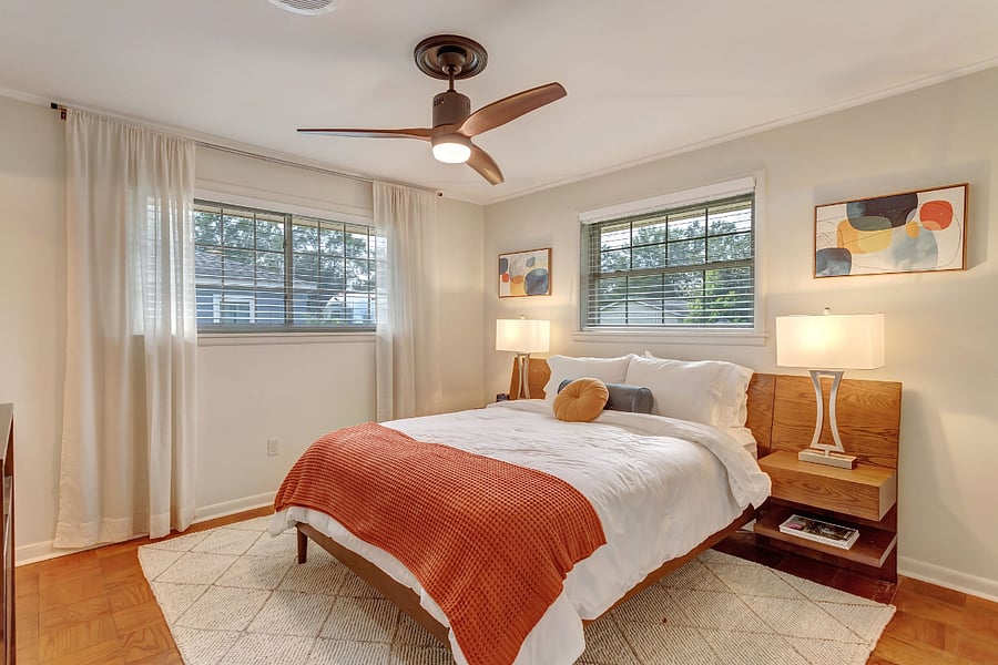 Primary bedroom with full bathroom, queen bed, large walk-in closet, tv and alarm clock with bluetooth / phone charger.  