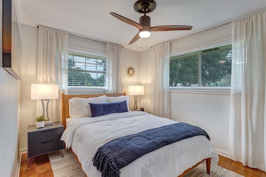 Second bedroom with queen bed, closet, tv and alarm clock with bluetooth / phone charger.  