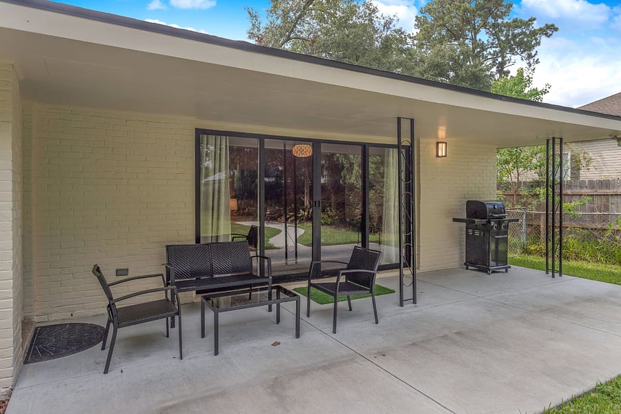 Enjoy entertaining with a large fenced backyard, large covered patio, grill and yard service included.  