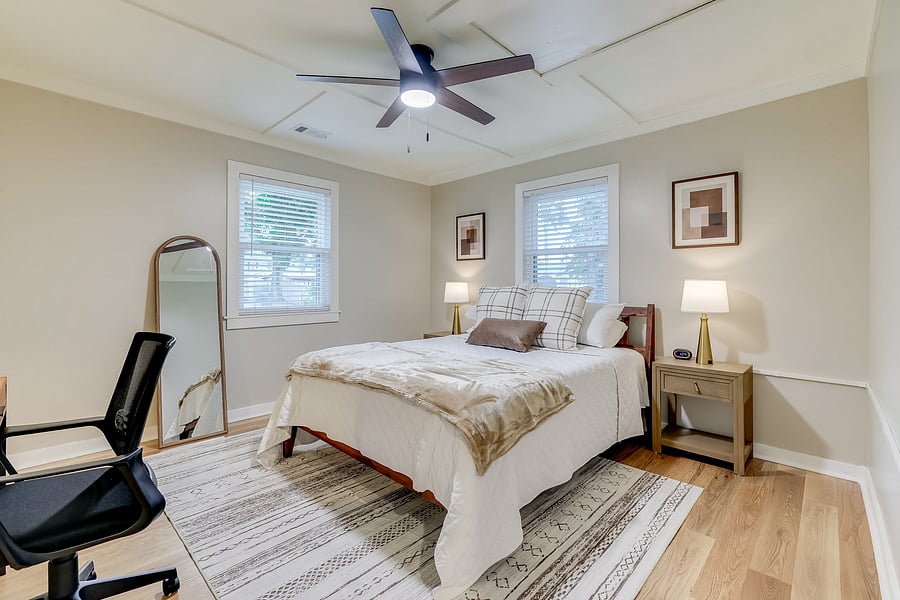 Feel refreshed after a good night's sleep in this queen bedroom, equipped with a dedicated work space and desk.