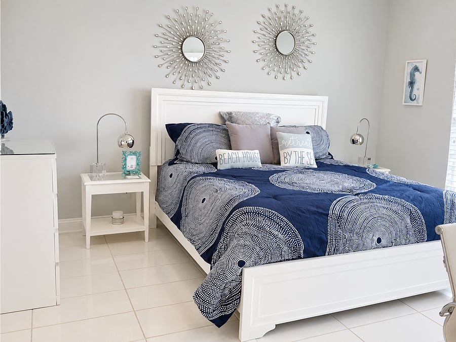 Retreat to a comfortable bedroom with coastal styling and a calm, restful atmosphere.