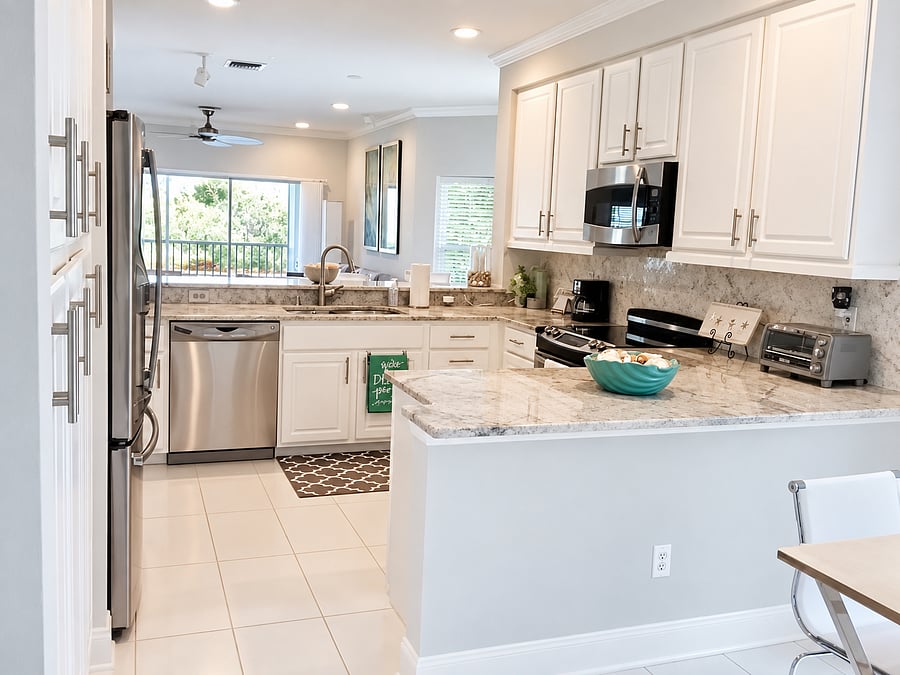 Full-size appliances and abundant cabinetry give you the practical kitchen setup you want when staying a month or more.