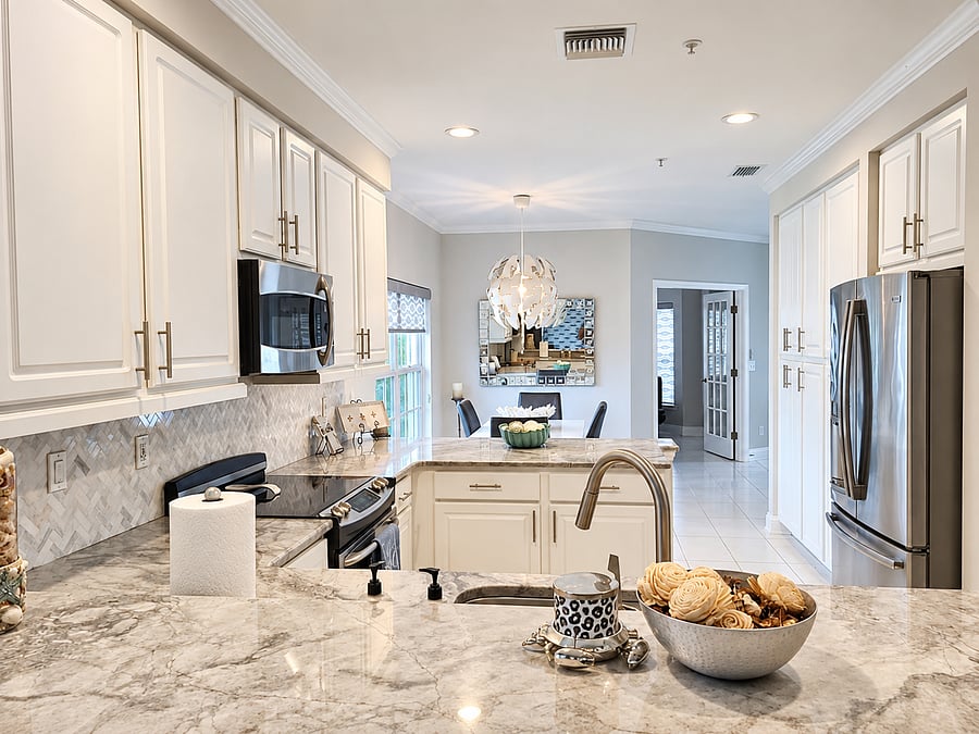 Kitchen provides an easy flow from meal prep into the living and dining areas making it easy to join in the conversation while also preparing meals.