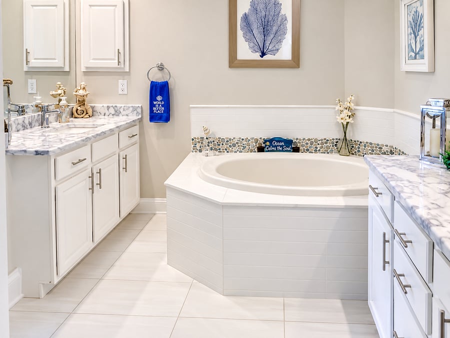 The spacious primary bath offers generous vanity space and a soaking tub for relaxing at the end of the day.