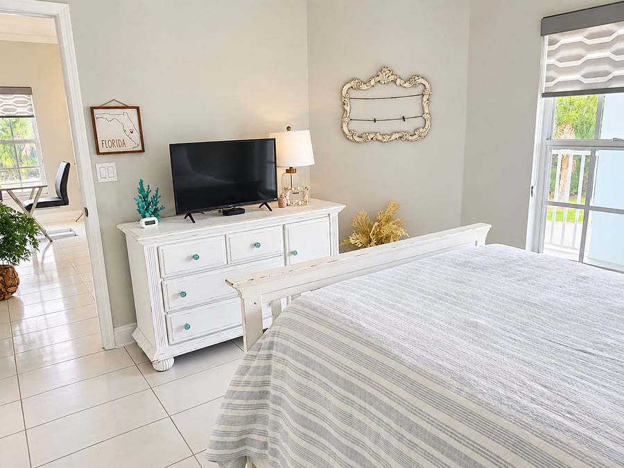 This additional bedroom angle highlights the dresser, TV and storage that make longer stays more convenient.