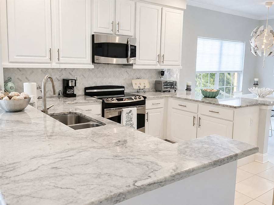 A spacious, fully equipped kitchen offers generous counter space for everyday meals and longer-term living.