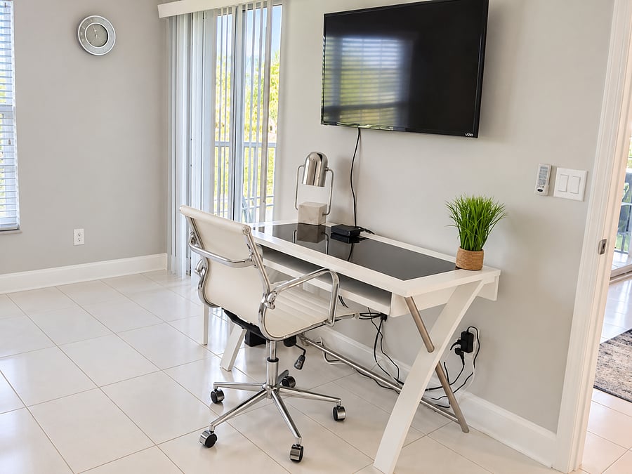 A dedicated desk and office chair create a convenient work-from-home space for remote work, travel assignments or extended stays.