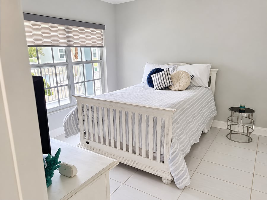 A second well-appointed bedroom provides a comfortable private space for family, guests or a roommate.