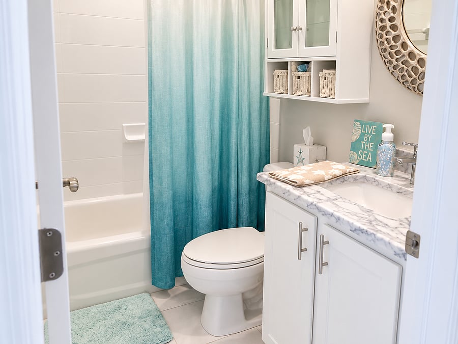 The second full bath includes a tub/shower combination and convenient storage for guests or family.
