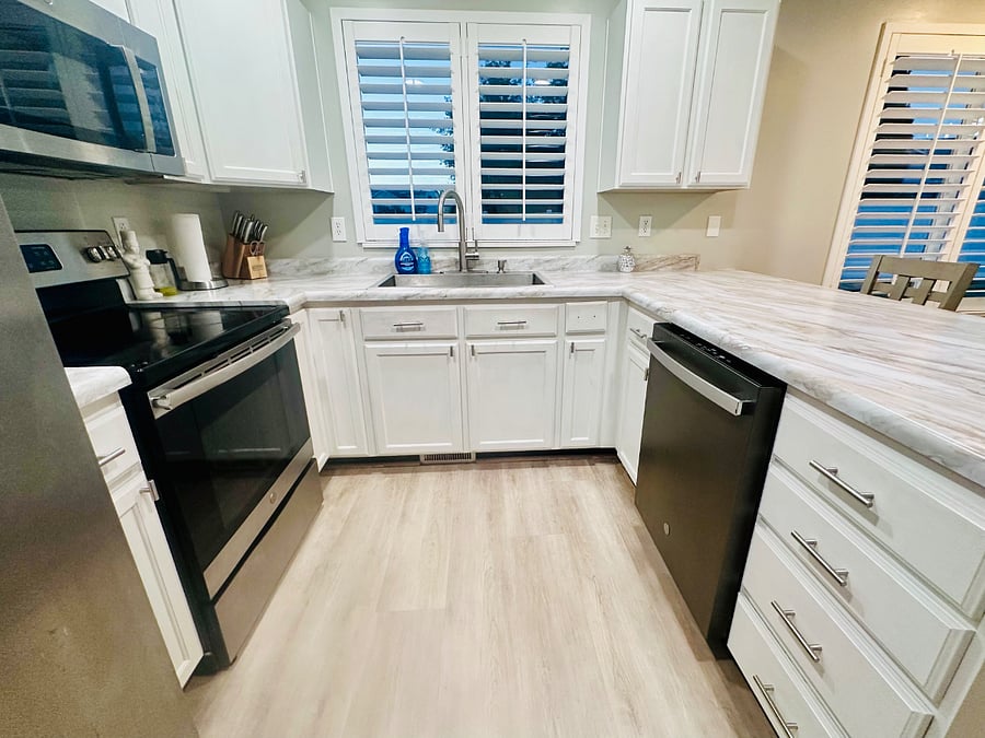 Fully equipped shared kitchen with stainless steel appliances and ample counter and cabinet space.
