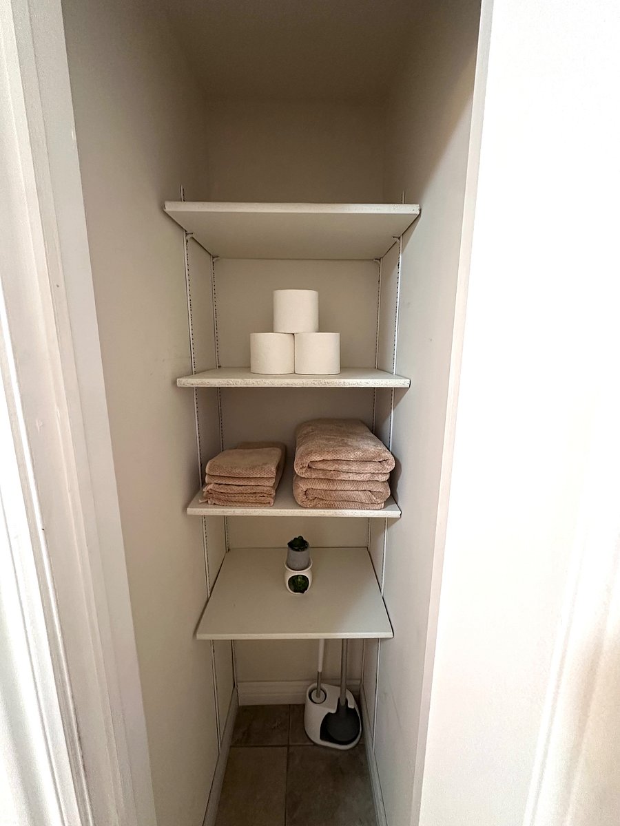Dedicated bathroom storage with towels and washcloths provided