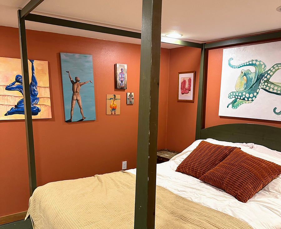 Basement bedroom, with gallery wall of all original artwork