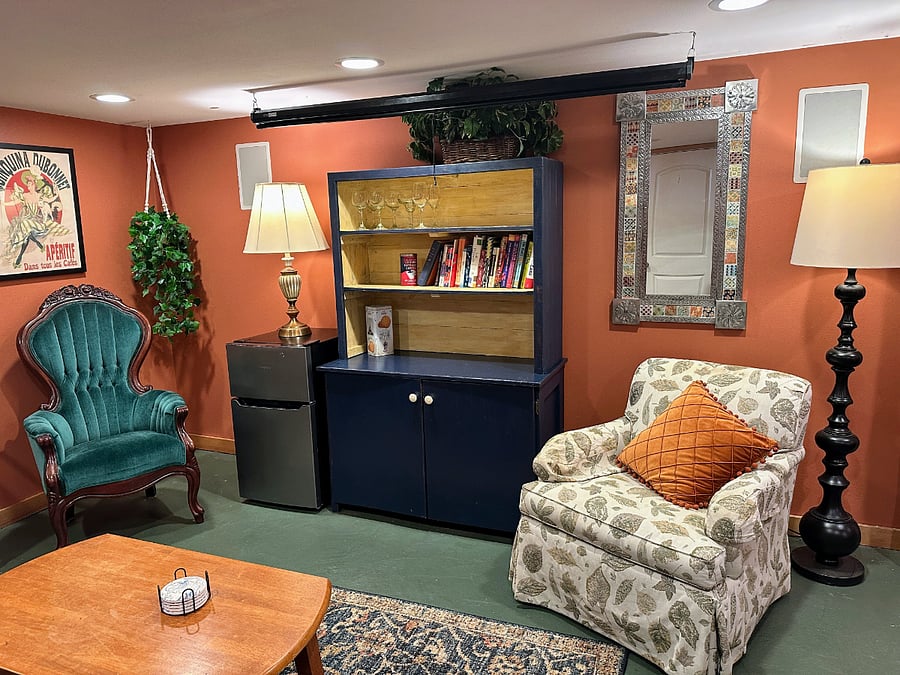 Basement living/entertainment room with mini fridge