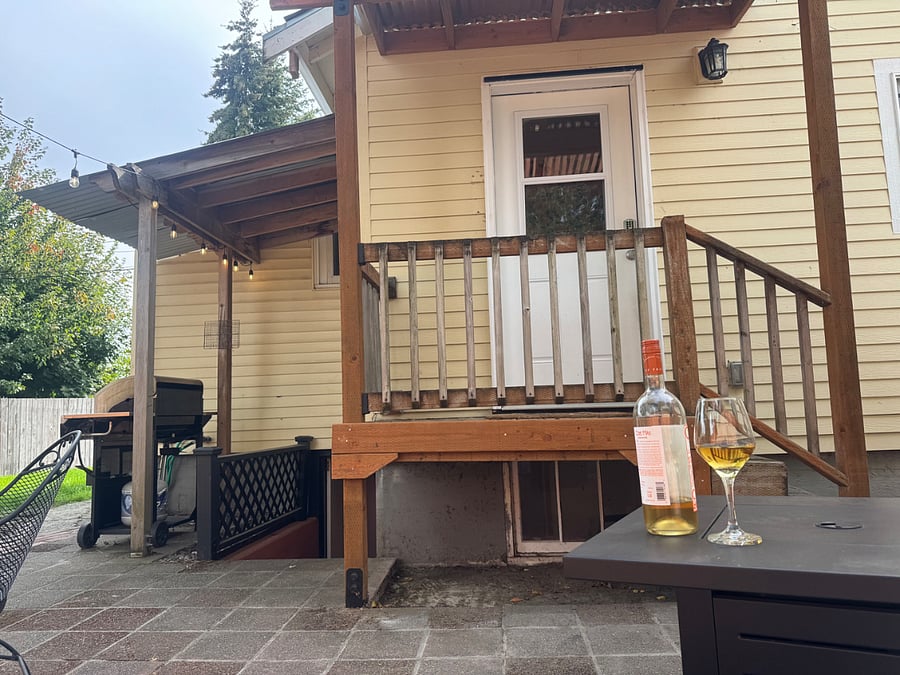 Facing the kitchen door, and basement entry.