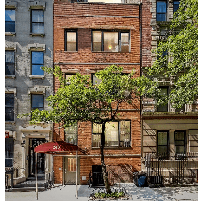 View of front entrance from across the street.  Unit is the second floor, behind the trees.  