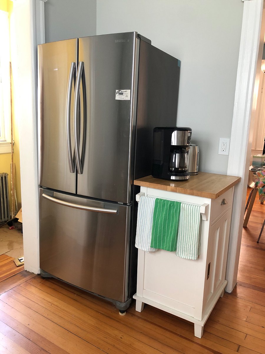 Fridge with ice maker, coffee maker, hot water maker.