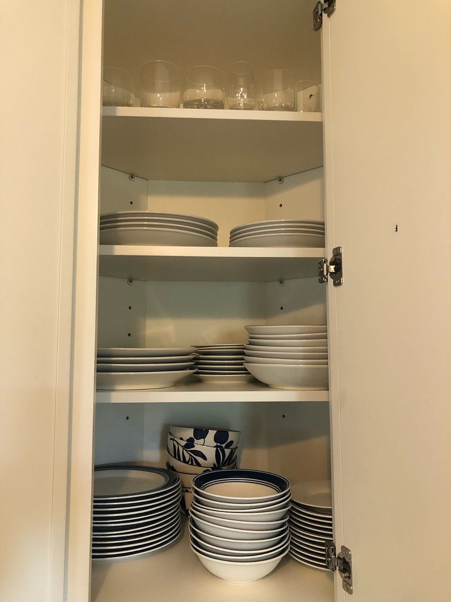 Fully equipped kitchen includes plenty of plates, bowls, utensils, etc.