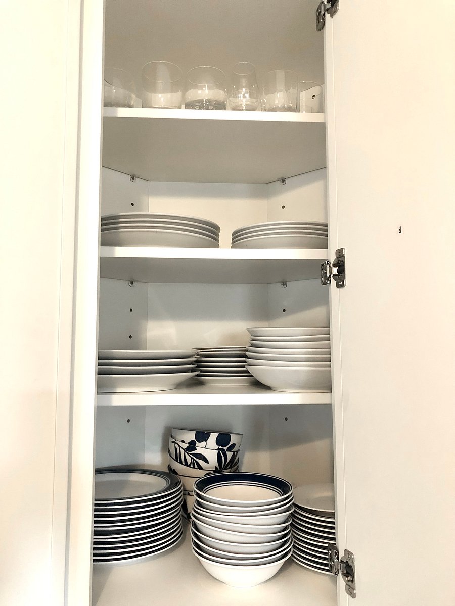 Fully equipped kitchen includes plenty of plates, bowls, utensils, etc.