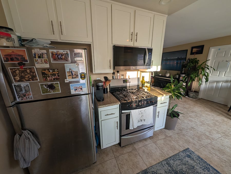 Kitchen: refrigerator, stove, and microwave