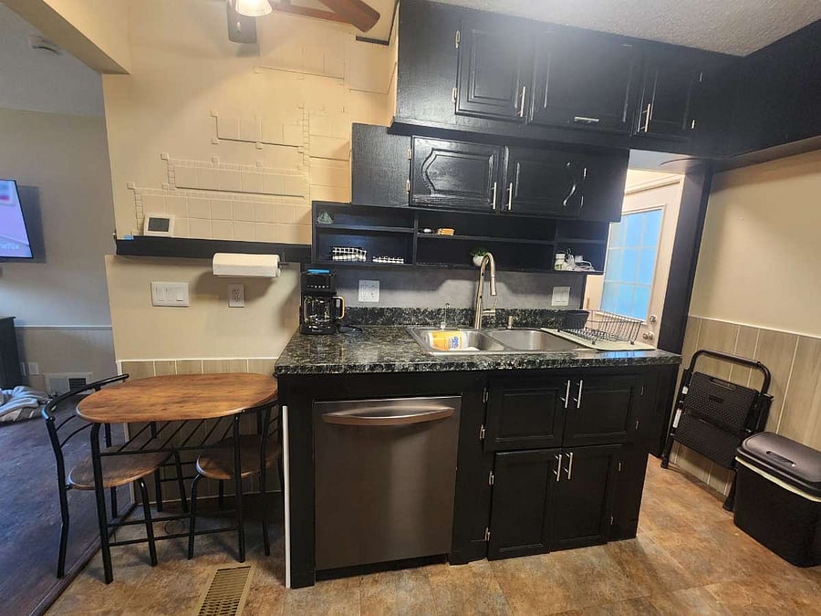 Kitchen: pots, pans, crockpot, dishes, cups, utensils