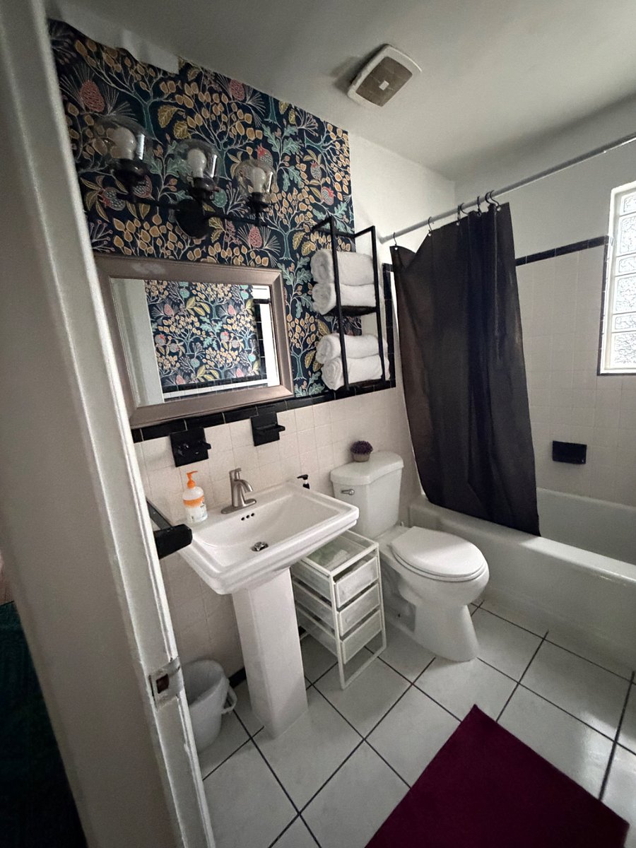 Bathroom with tub, rain shower & all toiletries