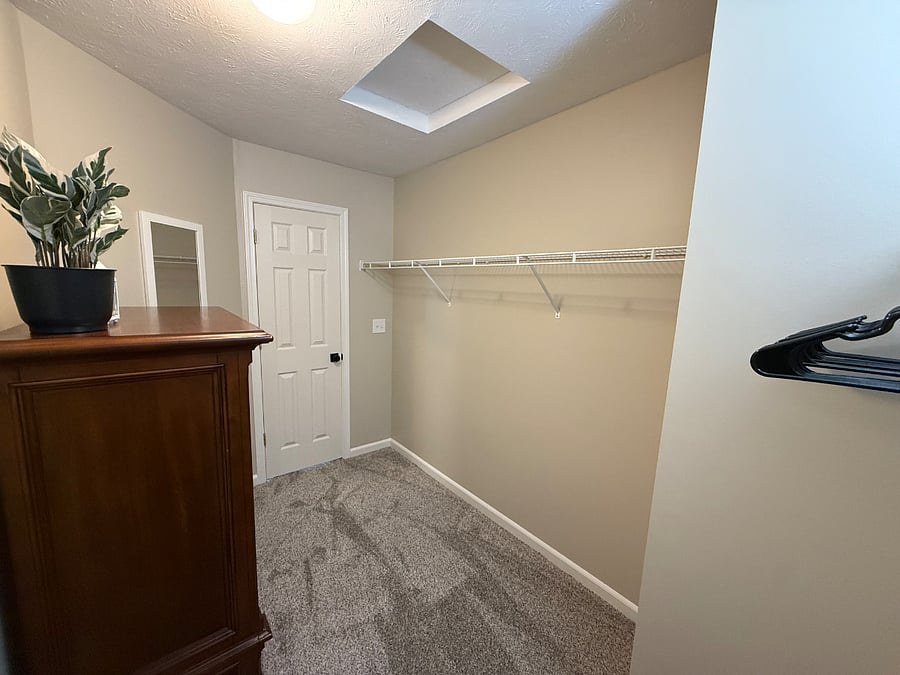 Large walk-in closet in master bedroom. 